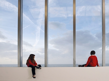 Schoolchildren admire the view from the Clore Learning Studio at Turner Contemporary, Margate